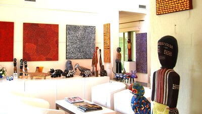 Handcrafted carvings and original paintings by Papunya and Utopia artists.